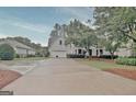 Elegant two-story home with a spacious driveway and well-maintained landscaping at 207 Tiverton Trl, Peachtree City, GA 30269