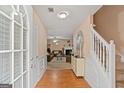 View of foyer with staircase and view into living room with fireplace at 5865 El Segundo Way, Atlanta, GA 30349