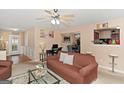 The living room features comfortable seating and a glimpse into the adjacent dining area at 5865 El Segundo Way, Atlanta, GA 30349