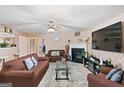 Cozy living room with a ceiling fan, fireplace, and plush furniture at 5865 El Segundo Way, Atlanta, GA 30349