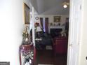 Inviting entryway leading to a comfortable living room with fireplace and stylish furniture at 4032 Ward Lake Trl, Ellenwood, GA 30294