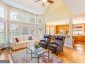 Bright living room boasting large windows, hardwood floors, and an open concept design at 2810 Promenade Pl, Buford, GA 30519