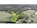 Expansive property featuring a large cleared lot surrounded by mature trees, ponds, and serene natural landscape at 68 Riveree Rd, Brooks, GA 30205