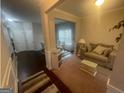 Open floor plan with living room, dining room, and hallway for modern living at 5470 Hilltop Pass, Fairburn, GA 30213
