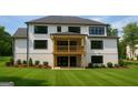 A well-maintained backyard features a covered patio and a spacious lawn at 2868 Octavia Cir, Marietta, GA 30062