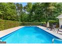 Refreshing in-ground pool with a clean, well-maintained deck area, perfect for summer relaxation at 210 Farr Lake Dr, Tyrone, GA 30290
