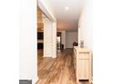 Inviting entryway with gleaming wood floors and an open view into the home's living spaces at 1243 Polk Xing, Mcdonough, GA 30252