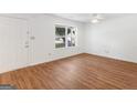 Bright living room with hardwood floors and a large window providing natural light at 150 Glynn Addy Dr, Stockbridge, GA 30281