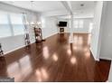 Bright and spacious living room with hardwood flooring, fireplace and open floor plan at 5229 Tye, Fairburn, GA 30213