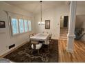 Bright dining room featuring white trim, hardwood floors and modern chandelier at 2062 Valiant Ne Dr, Atlanta, GA 30345