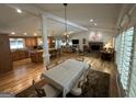 Spacious living room and dining area with hardwood floors, fireplace, and lots of natural light at 2062 Valiant Ne Dr, Atlanta, GA 30345