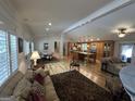 Open floor plan features the living room, dining room and kitchen with hardwood flooring at 2062 Valiant Ne Dr, Atlanta, GA 30345