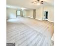 Expansive bonus room with neutral carpeting, a ceiling fan, recessed lighting, and windows at 759 Hennepin Ter, Mcdonough, GA 30253
