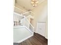 Spacious foyer featuring hardwood floors, a staircase, and double doors, offering a grand entrance at 759 Hennepin Ter, Mcdonough, GA 30253