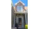 Close-up of the front door, featuring stone accents and a bright, welcoming entrance at 7314 Basalt Dr, Union City, GA 30291