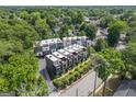 Aerial view of modern townhome community surrounded by lush greenery and mature trees at 710 Oakview Rd, Decatur, GA 30030