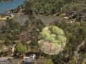 A lakefront neighborhood has mature trees surrounding lovely homes and a beautiful, peaceful lake at 2270 Emerald Dr, Jonesboro, GA 30236