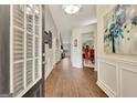 Welcoming entryway featuring hardwood floors, decorative molding, and an open doorway at 395 Sylvan Loop, Fayetteville, GA 30214