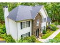 Two-story home boasting a stone facade and meticulously landscaped front yard, offering great curb appeal at 97 Coral Dr, Whitesburg, GA 30185