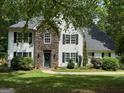 Charming two-story home featuring a stone facade, a welcoming entrance, and well-maintained landscaping at 97 Coral Dr, Whitesburg, GA 30185