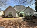 Spacious backyard featuring an outdoor patio perfect for relaxing and entertaining at 12313 Riviera Dr, Fayetteville, GA 30215
