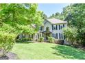 Beautifully landscaped front yard featuring a two-story house with black shutters and a well-manicured lawn at 350 Ridgemont Dr, Fayetteville, GA 30215