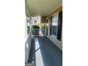 Side porch, providing an excellent spot for outdoor relaxation with a covered space and neighborhood views at 6120 Raleigh Oaks Ct, Lithonia, GA 30058