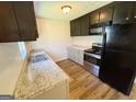 Efficient kitchen design with stainless steel appliances and durable granite countertops at 36 Reese St, Grantville, GA 30220