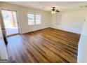 Open floor plan living room with backyard porch access and a view of the private backyard at 36 Reese St, Grantville, GA 30220