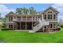 Spacious outdoor deck and walkout basement offer ample space for entertaining at 115 Edgewood Pkwy, Fayetteville, GA 30215