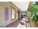 Relaxing covered porch featuring a seating area, string lights, and a welcoming atmosphere at 3007 Brush Arbor Xing, Mcdonough, GA 30252