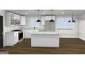 Bright modern kitchen with white cabinets, stone countertops, stainless appliances, and stylish pendant lighting at 4274 Kimball Sw Rd, Atlanta, GA 30331