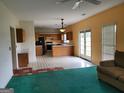 Open living space blending the kitchen and seating area, with lots of natural light at 690 Gateway Ct, Stone Mountain, GA 30087