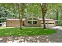 Charming single-Gathering home with a lush green lawn and attached garage at 152 Dana Dr, Fayetteville, GA 30215