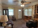 Inviting living room with natural light, comfortable seating, and vintage-style furnishings at 4884 Maurice Nw Dr, Lilburn, GA 30047