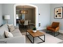 Inviting living room with stylish light fixture, modern decor, and neutral color palette at 2134 Main Nw St, Atlanta, GA 30318