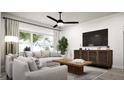 Bright living room with large window, comfortable seating, and modern decor at 100 Trombone Way, Mcdonough, GA 30252