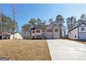 Charming two-story home with a well-manicured lawn and an inviting entrance at 3279 Greenhill Dr, Villa Rica, GA 30180