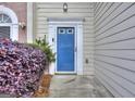Inviting entryway featuring a blue front door and neat landscaping at 5640 Terremont Cir, Norcross, GA 30093