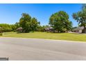 Beautiful homes on expansive, well-manicured lawns create a picturesque neighborhood setting at 125 Lake Park Dr, Sharpsburg, GA 30277