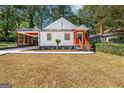 Charming craftsman home with inviting front porch and steps leading to the black front door at 317 Mcpherson Se Pl, Atlanta, GA 30316