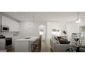 Open-concept kitchen and living area with an island and modern appliances at 1217 Trombone Way # 6, Mcdonough, GA 30252