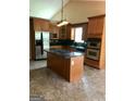 Well-equipped kitchen featuring stainless steel appliances, granite countertops, and a center island at 436 Abbey Pl, Villa Rica, GA 30180