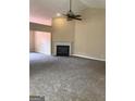 Spacious living room with neutral carpet, fireplace and fan at 436 Abbey Pl, Villa Rica, GA 30180