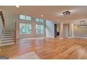 Bright living room featuring hardwood floors, recessed lighting, and tall windows at 375 Foster Dr, Mcdonough, GA 30253