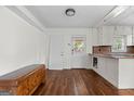 Bright kitchen area with wood floors and modern fixtures and lots of natural light at 397 Campground Rd, Mcdonough, GA 30253