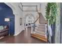 Spacious foyer with staircase and open view to other living areas at 407 Blue Smoke Trl, Peachtree City, GA 30269