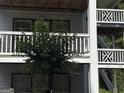 Close-up shot of a multi-story building exterior with gray siding and staircases at 3480 Shepherds Path, Decatur, GA 30034