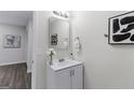 Modern bathroom vanity offers updated faucet, neutral paint, and minimalist framed mirror at 389 Oglesby Bridge, Conyers, GA 30094