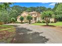 Charming home with a well-manicured lawn and mature trees, offering a picturesque view of the property at 226 Long Island Dr, Whitesburg, GA 30185